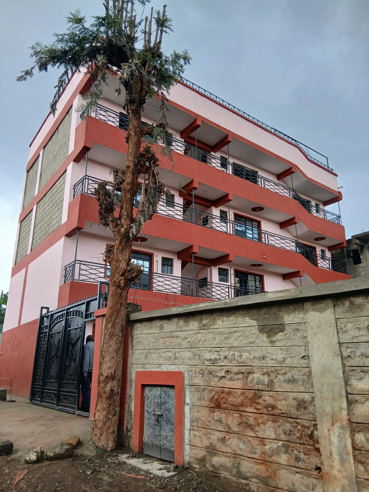 Red and cream multi-story residential building facade