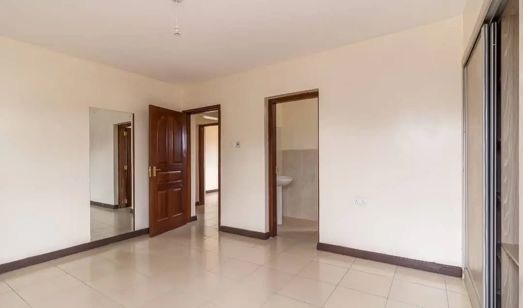 Spacious empty living room with polished tile flooring