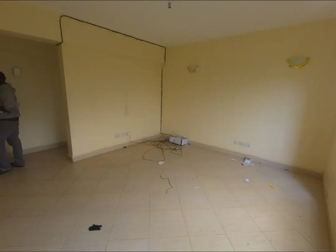 Empty living room with yellow walls, under construction or renovation