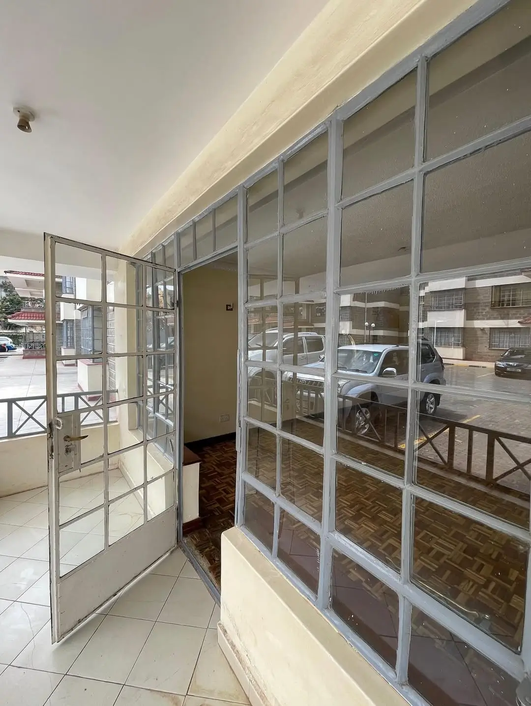 Building lobby with glass partitions overlooking underground parking