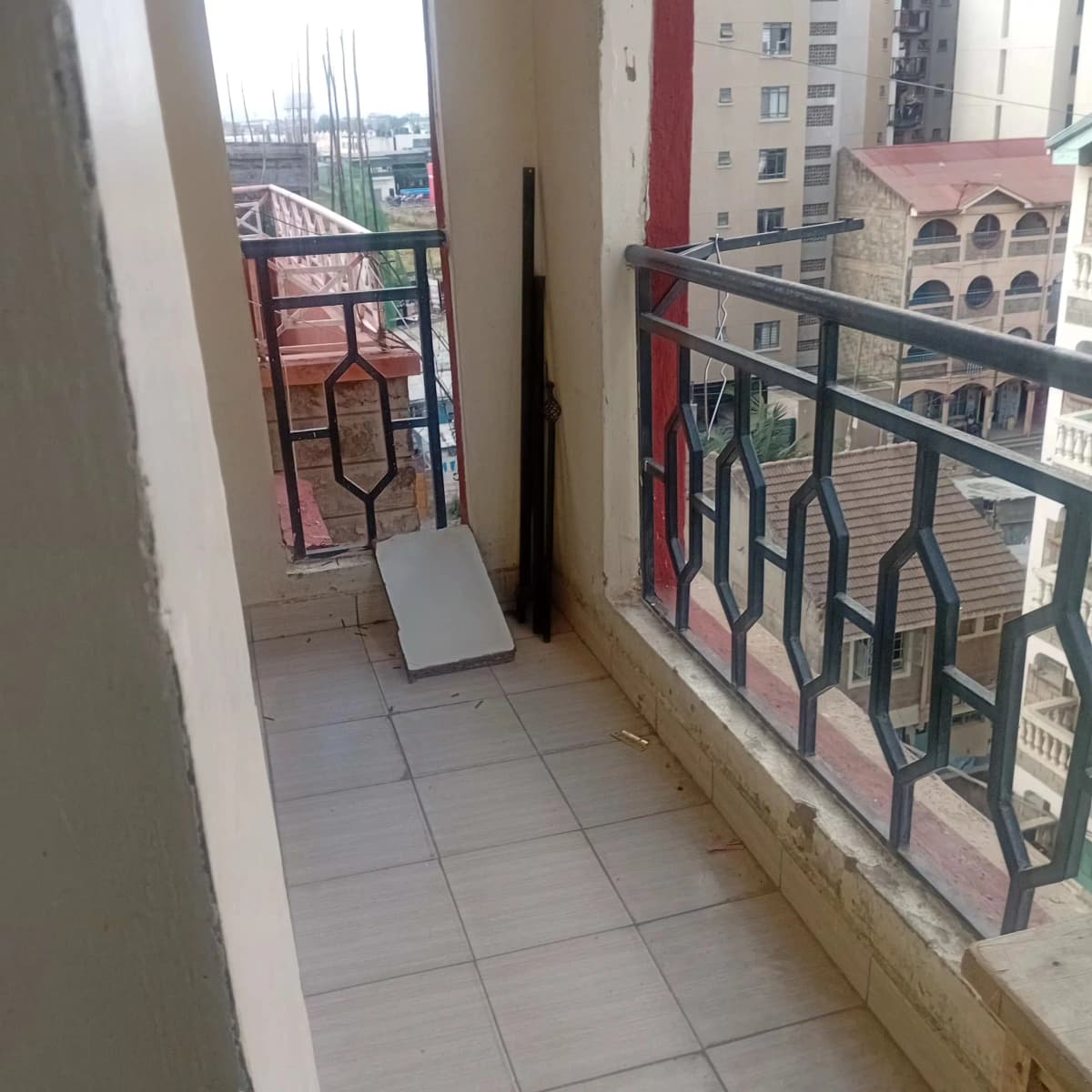 Elevated balcony with city views and metal railings