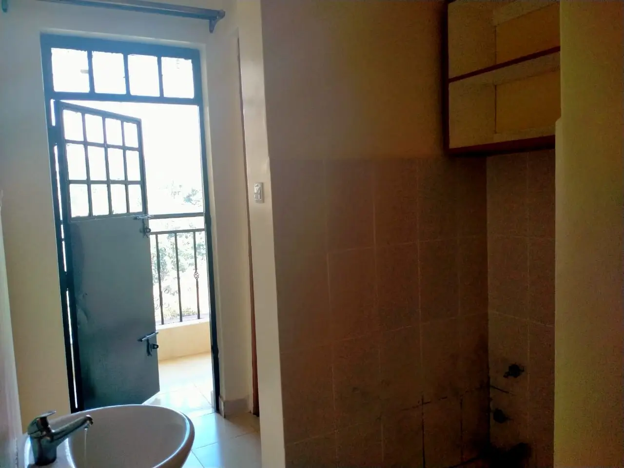 Bedroom with built-in wardrobe and balcony access door